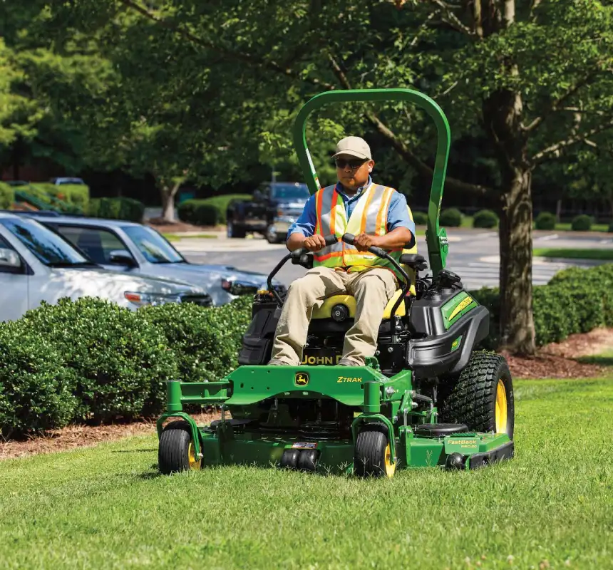 Affordable tree care specialist using lawn care equipment to provide lawn care services.